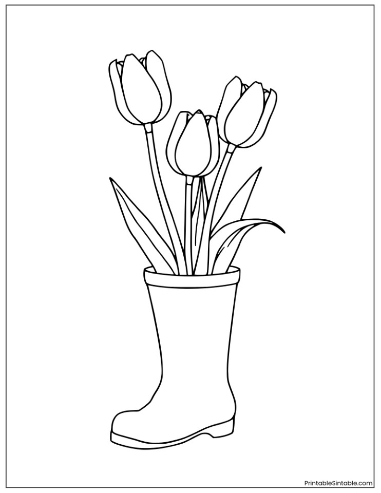 tulip flowers growing from a boot